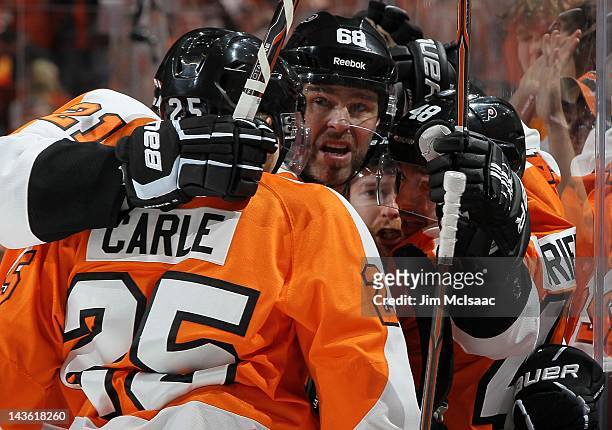 Matt Carle, Danny Briere and Jaromir Jagr of the Philadelphia Flyers celebrate against the New Jersey Devils in Game One of the Eastern Conference...