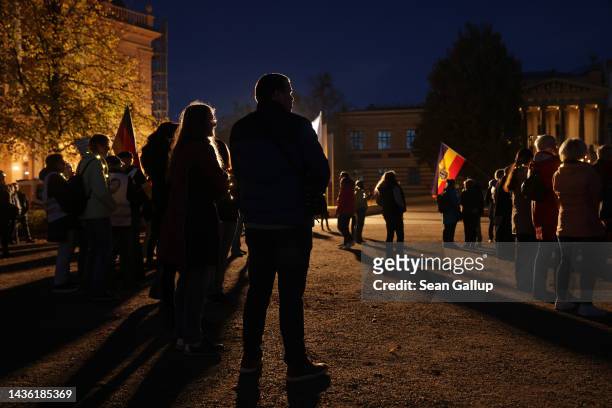 Demonstrators gather for a Monday-night protest "stroll" on October 24, 2022 in Schwerin, Germany. While the "strolls" attract a range of malcontents...