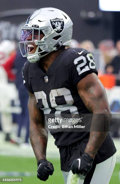 Running back Josh Jacobs of the Las Vegas Raiders celebrates his 4-yard touchdown run against the Houston Texans in the second half of their game at...
