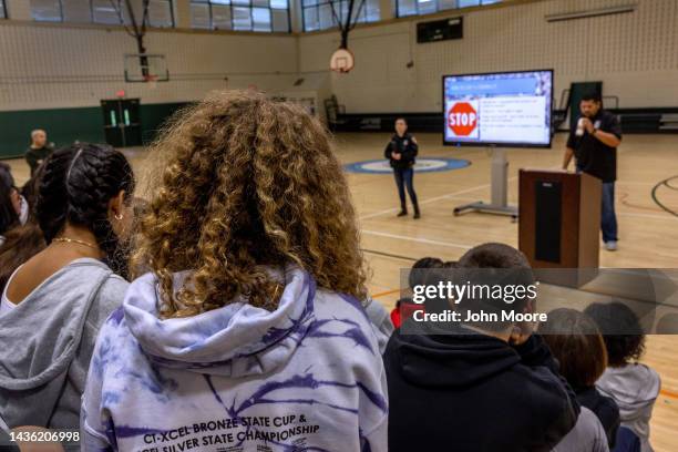 Eighth grade students listen to a police lecture on internet safety and cyberbullying at the Scofield Magnet Middle School on October 24, 2022 in...