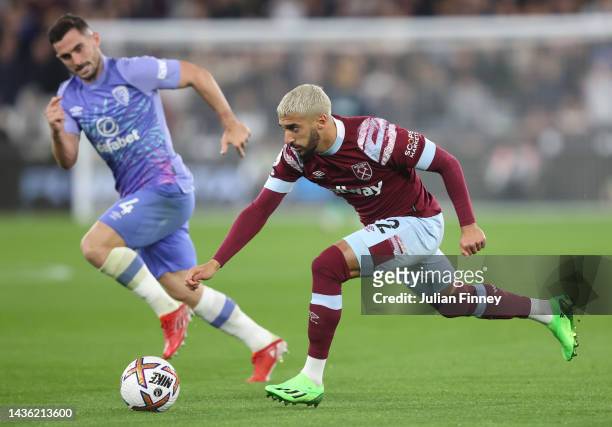 Said Benrahma of West Ham United battles for possession with Lewis Cook of AFC Bournemouth during the Premier League match between West Ham United...
