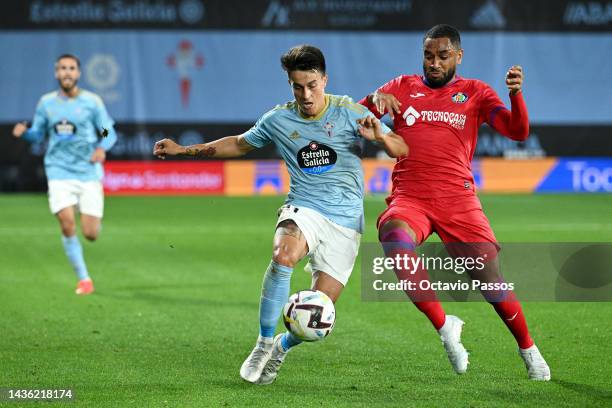 Franco Cervi of Celta Vigo battles for possession with Jordan Amavi of Getafe CF during the LaLiga Santander match between RC Celta and Getafe CF at...