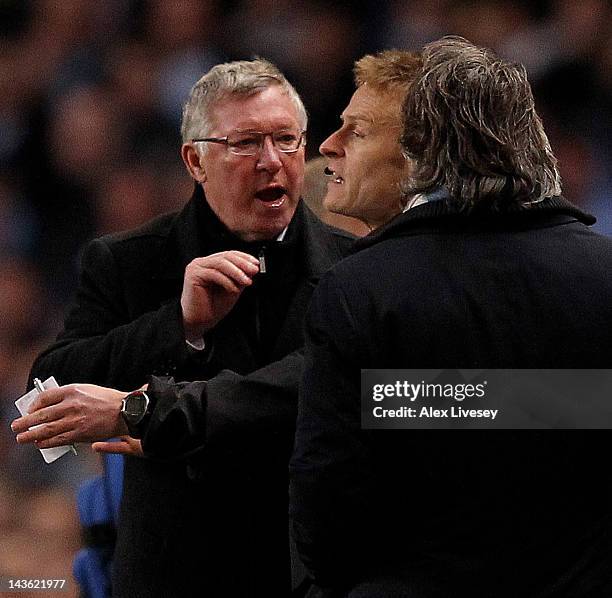 Manchester United Manager Sir Alex Ferguson clashes with Manchester City Manager Roberto Mancini during the Barclays Premier League match between...
