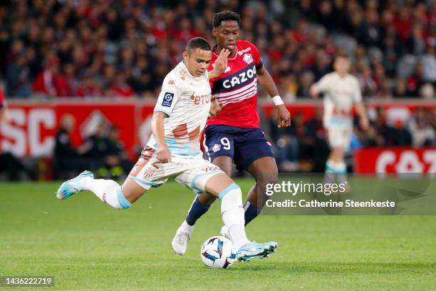 Vanderson De Oliveira Campos of AS Monaco controls the ball against Jonathan Christian David of Lille OSC during the Ligue 1 match between Lille OSC...