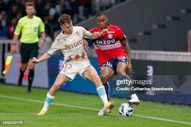 Aleksandr Golovin of AS Monaco challenges Bafode Diakite of Lille OSC during the Ligue 1 match between Lille OSC and AS Monaco at Stade Pierre-Mauroy...