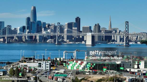 In an aerial view, shipping containers sit on a dock at the Port of Oakland on October 24, 2022 in Oakland, California. The State of California,...