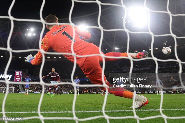 Said Benrahma of West Ham United scores their side's second goal from the penalty spot past Mark Travers of AFC Bournemouth during the Premier League...
