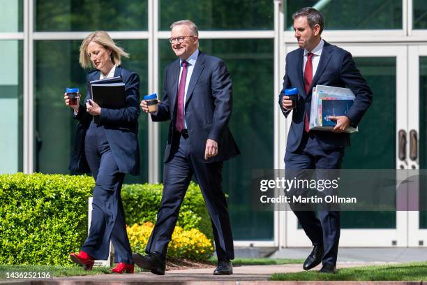 Australian Prime Minister Anthony Albanese, federal Treasurer Jim Chalmers and Finance Minister Katy Gallagher walk outside Parliament House on...