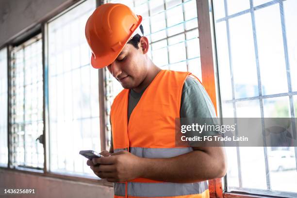 Worker Using Phone 5,277 Industrial Site Worker Phone Stock Photos, High-Res Pictures, and ...