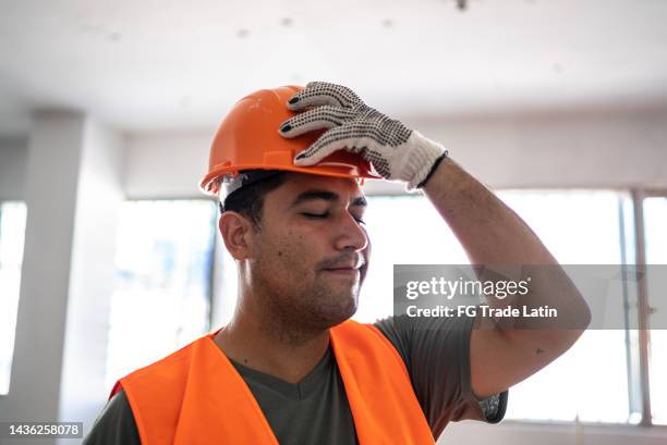 worried engineer/construction worker working in a construction site - construction mistake stock pictures, royalty-free photos & images