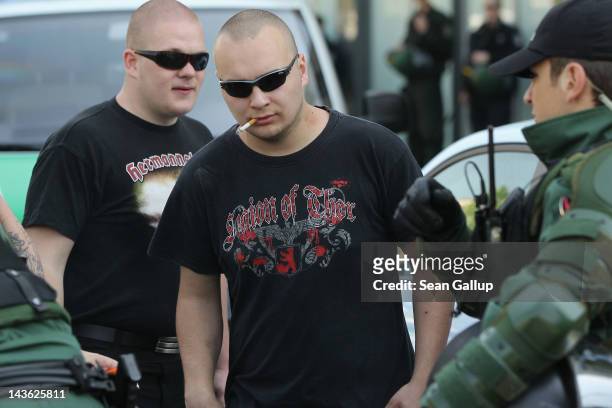 Police search supporters of the far-right NPD political party as they arrive for a rally on the eastern city outskirts on May Day on May 1, 2012 in...