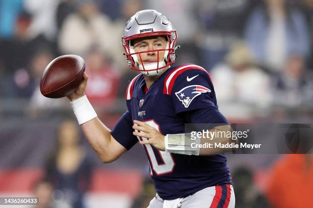 Mac Jones of the New England Patriots looks to pass during the first half against the Chicago Bears at Gillette Stadium on October 24, 2022 in...