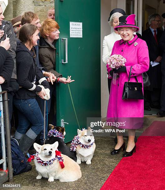 Queen Elizabeth II greest well wishers with corgis during a visit to Sherborne Abbey on May 1, 2012 in Sherborne, England. The Queen and Duke of...