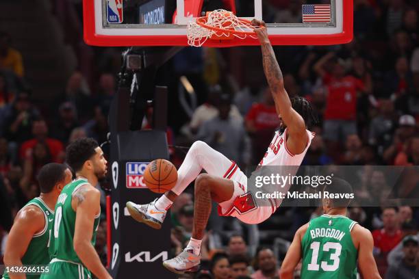 Derrick Jones Jr. #5 of the Chicago Bulls dunks against the Boston Celtics during the first half at United Center on October 24, 2022 in Chicago,...