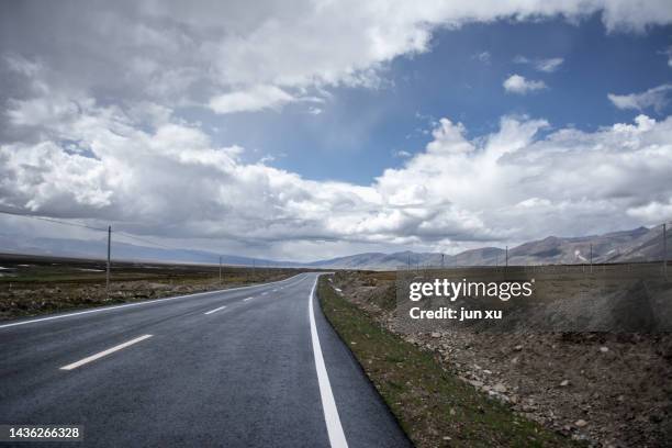 express lane of blue sky and white clouds on the ali plateau in tibet - チベット ストックフォトと画像