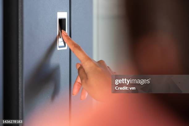 putting finger on scanner for opening futuristic house doors - fingerprint scanner stock pictures, royalty-free photos & images