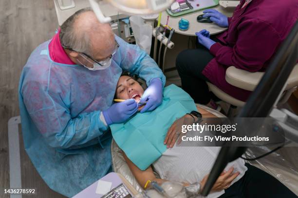 dentist working on pregnant patient - periodontal disease stock pictures, royalty-free photos & images