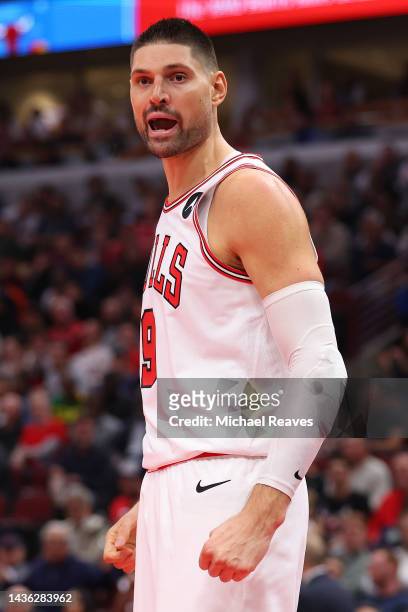 Nikola Vucevic of the Chicago Bulls celebrates against the Boston Celtics during the second half at United Center on October 24, 2022 in Chicago,...