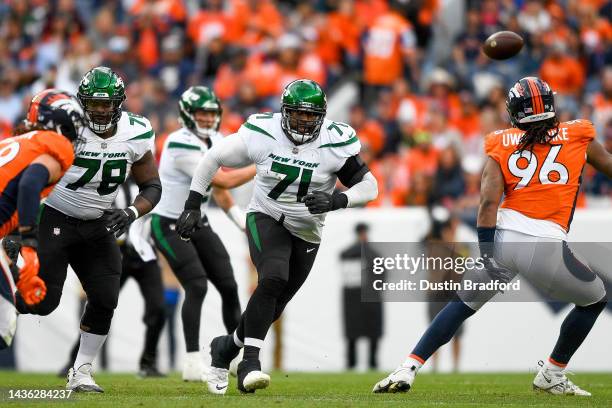 Offensive tackle Duane Brown of the New York Jets blocks against the Denver Broncos in a game at Empower Field at Mile High on October 23, 2022 in...