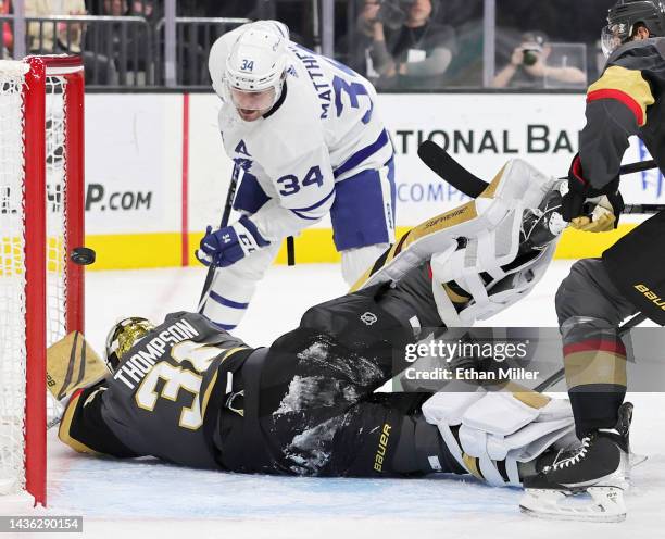 Logan Thompson of the Vegas Golden Knights makes a save against Auston Matthews of the Toronto Maple Leafs in the first period of their game at...