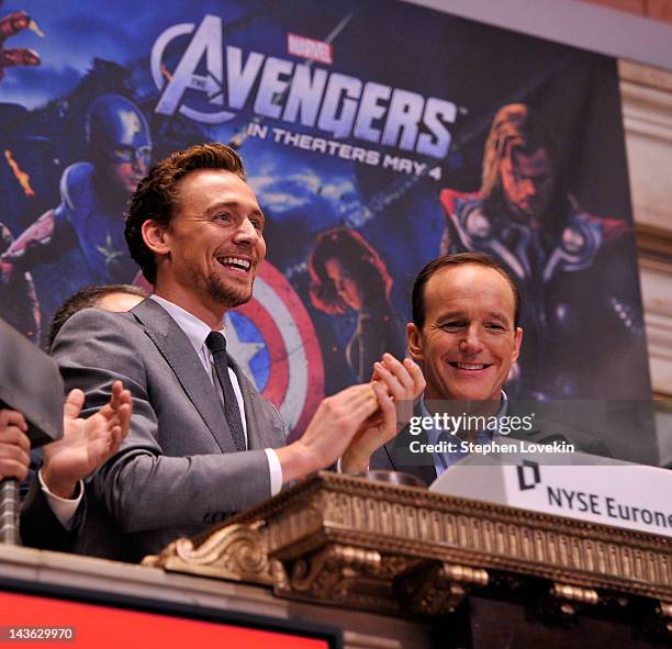 Actors Tom Hiddleston and Clark Gregg ring the opening bell at The New York Stock Exchange as part of a celebration of the release of Marvel Studios...