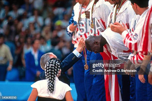 Michael Jordan of the United States Senior Mens team is presented a gold medal following a game against Croatia during the 1992 Olympics on August 8,...