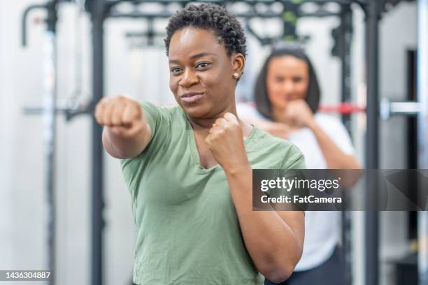 women's boxing fitness - punching stock pictures, royalty-free photos & images