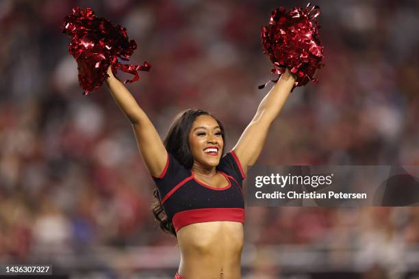 Arizona Cardinals cheerleaders perform during the NFL game at State Farm Stadium on October 20, 2022 in Glendale, Arizona. The Cardinals defeated the...