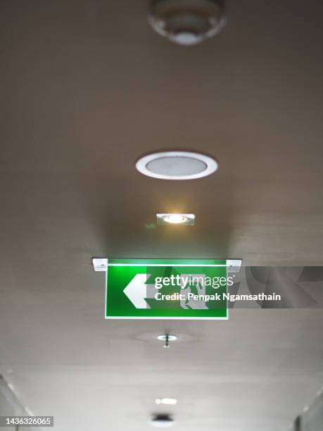 fire exit sign - door canopy stock pictures, royalty-free photos & images