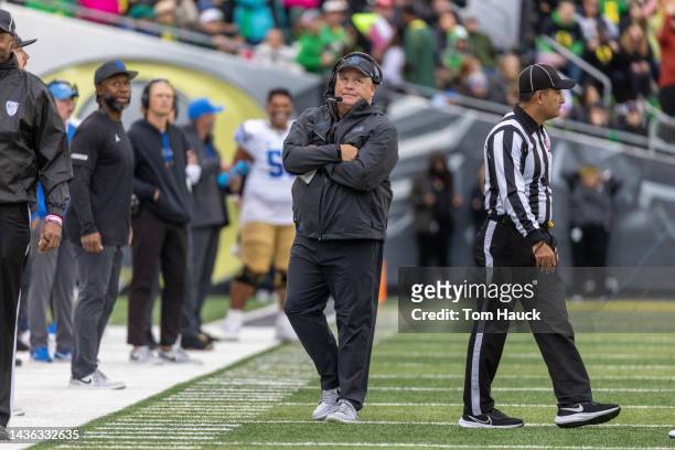 Head coach of the UCLA Bruins Chip Kelly stands on the sidelines during the first half against the Oregon Ducks at Autzen Stadium on October 22, 2022...