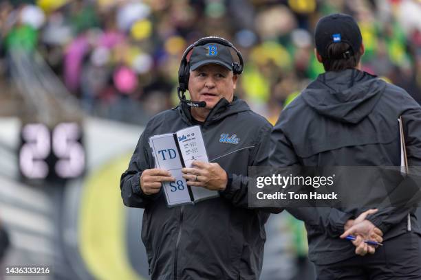 Head coach of the UCLA Bruins Chip Kelly stands on the sidelines during the first half against the Oregon Ducks at Autzen Stadium on October 22, 2022...