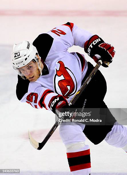Cam Janssen of the New Jersey Devils shoots the puck against the Florida Panthers in Game Seven of the Eastern Conference Quarterfinals during the...