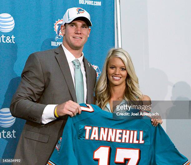 Ryan Tannehill and his wife Lauren hold his new Dolphins jersey after he was introduced to the media on April 28, 2012 at the Miami Dolphins training...