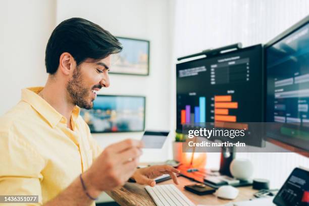 man working at standing desk - registration form stock pictures, royalty-free photos & images