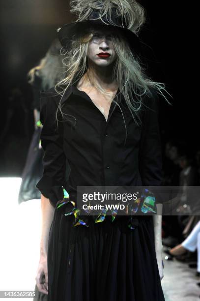 Model on the runway at Yohji Yamamoto's spring 2011 show at Espace Vendome.