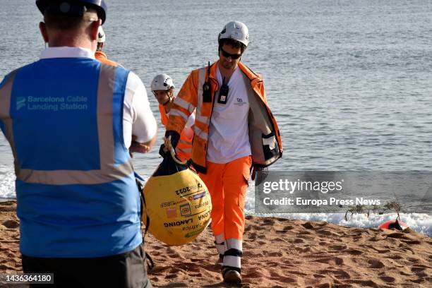Worker with the tip of the 2Africa submarine cable as it arrives at the Barcelona Cable Landing Station in Sant Adria de Besos, on 25 October, 2022...