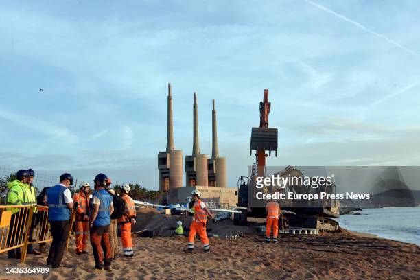 An excavator and workers at the arrival of the 2Africa submarine cable at the Barcelona Cable Landing Station in Sant Adria de Besos, on 25 October,...
