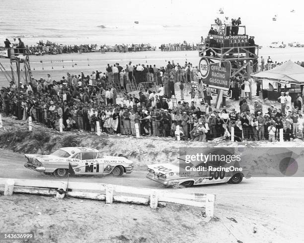 February 23, 1958: Phil Orr in a Ford mixes it up with the Pontiac of Fireball Roberts early in the running of the NASCAR Cup race on the Daytona...