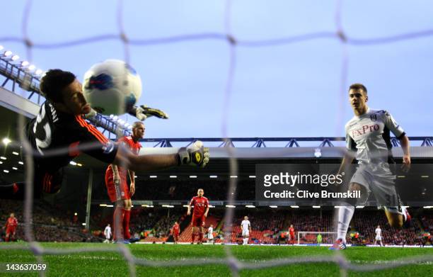 Martin Skrtel of Liverpool scores an own goal past team mate Alexander Doni during the Barclays Premier League match between Liverpool and Fulham at...