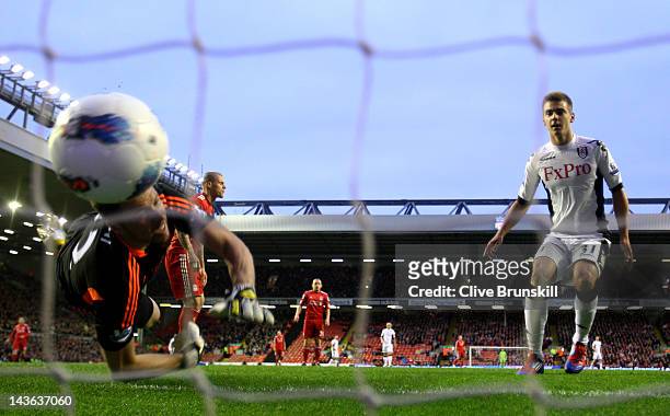 Martin Skrtel of Liverpool scores an own goal past team mate Alexander Doni during the Barclays Premier League match between Liverpool and Fulham at...