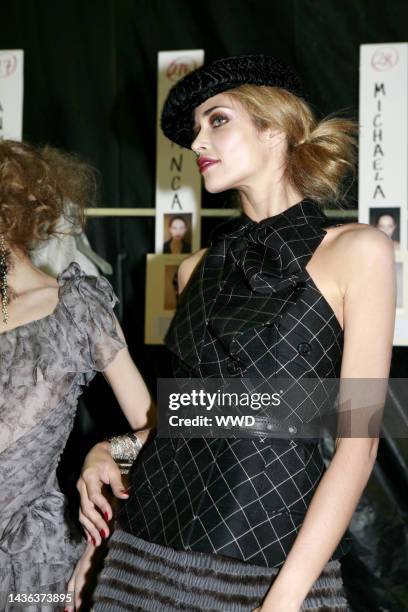 Model backstage at Christian Dior's fall 2010 runway show at Espace Ephemere Tuileries.