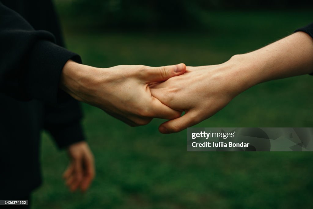 Couple holding hands