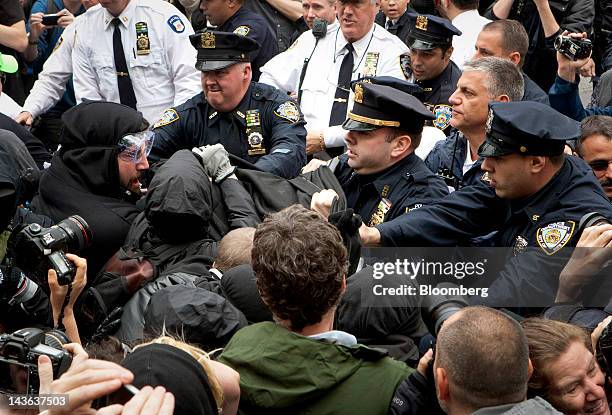 New York Police Department officers clash with demonstrators affiliated with the Occupy Wall Street movement protest in New York, U.S., on Tuesday,...