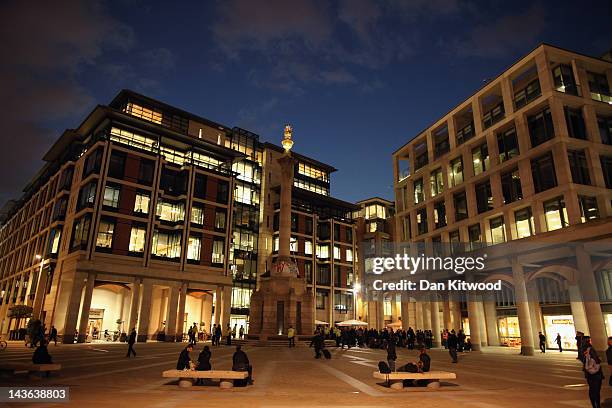 An Anti-capitalist protester from the 'Occupy' movement scales a column in Paternoster Square, which is adjacent to St Paul's Cathedral, their...