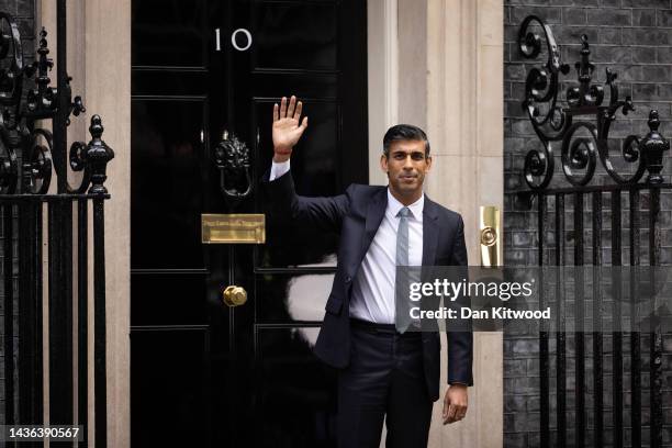 British Prime Minister Rishi Sunak waves to members of the media after taking office outside Number 10 in Downing Street on October 25, 2022 in...