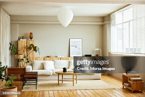 Sofa with coffee table by window in living room Sofa with coffee table by window in living room