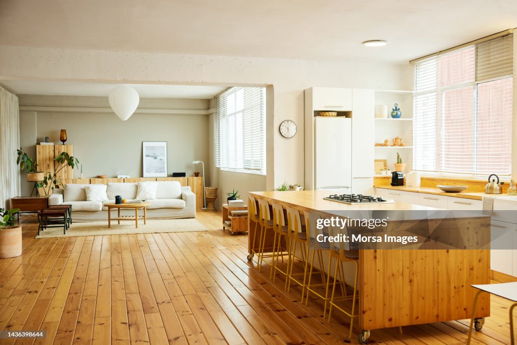 Chairs arranged at kitchen island in apartment