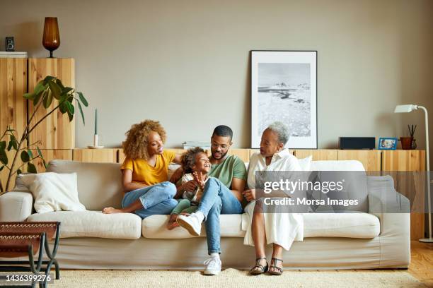 african american happy family is enjoying in living room - familia multi generacional fotografías e imágenes de stock