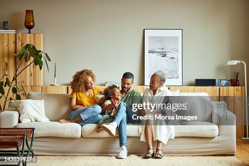 African American happy family is enjoying in living room African American happy family is enjoying in living room