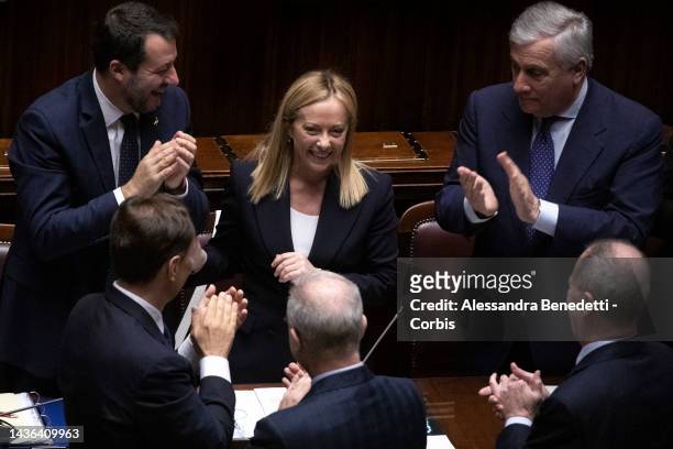 Italy's new Prime Minister Giorgia Meloni receives applauses from ministers of the new Italian government following her first address to parliament...